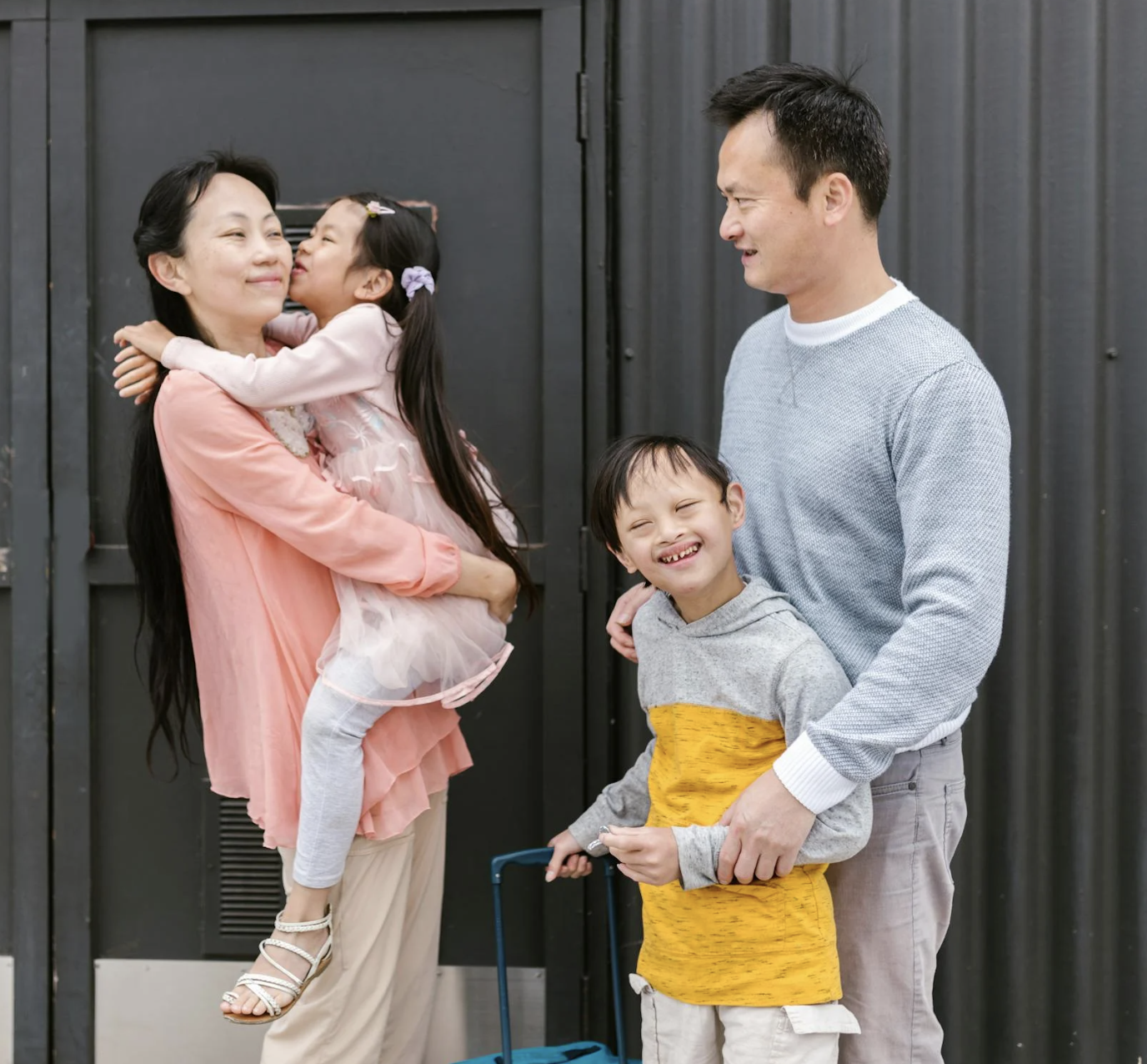 Happy family with mother, father, and two children